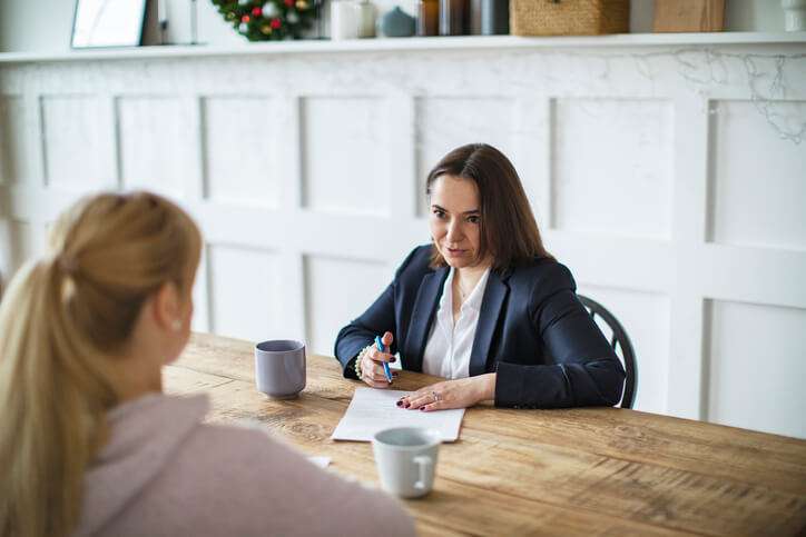 Female client sitting with personal injury attorney