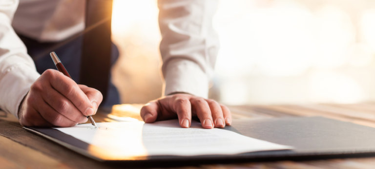 Man signing legal documents