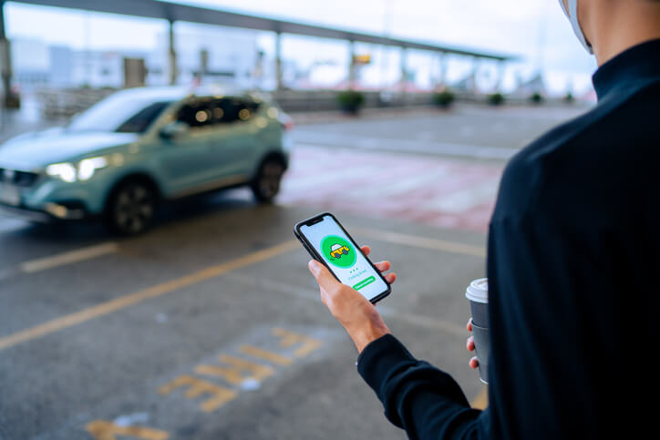 Person waiting for rideshare vehicle