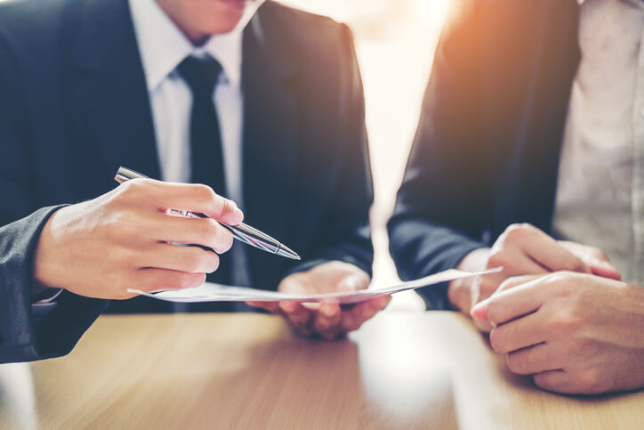 Business attorney sitting with client