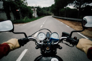Motorcycle Accident Lawyer Coral Gables, FL - Motorcycle handlebar POV on road highway