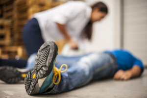 Slip And Fall Accident Lawyer Coral Gables, FL - man on floor with woman checking on him
