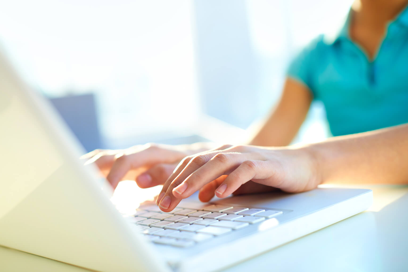 HOA lawyer Miami, fl - Close-up shot of a female learner typing on the laptop keyboard