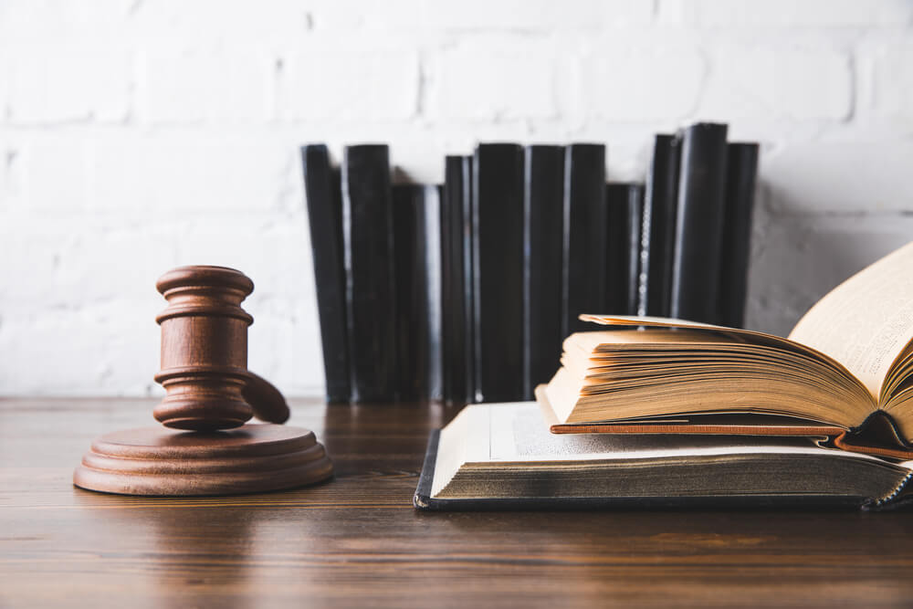 HOA lawyer Miami, fl-3 - legal books, gavel, on wooden desk