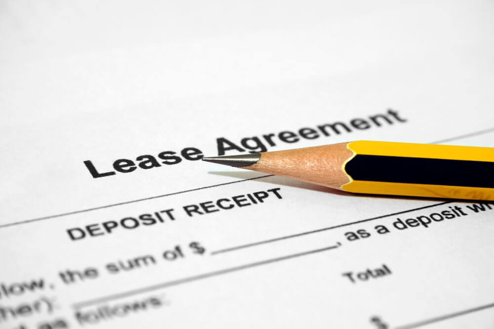 Handling Landlord-Tenant Disputes - lease agreement document with pencil