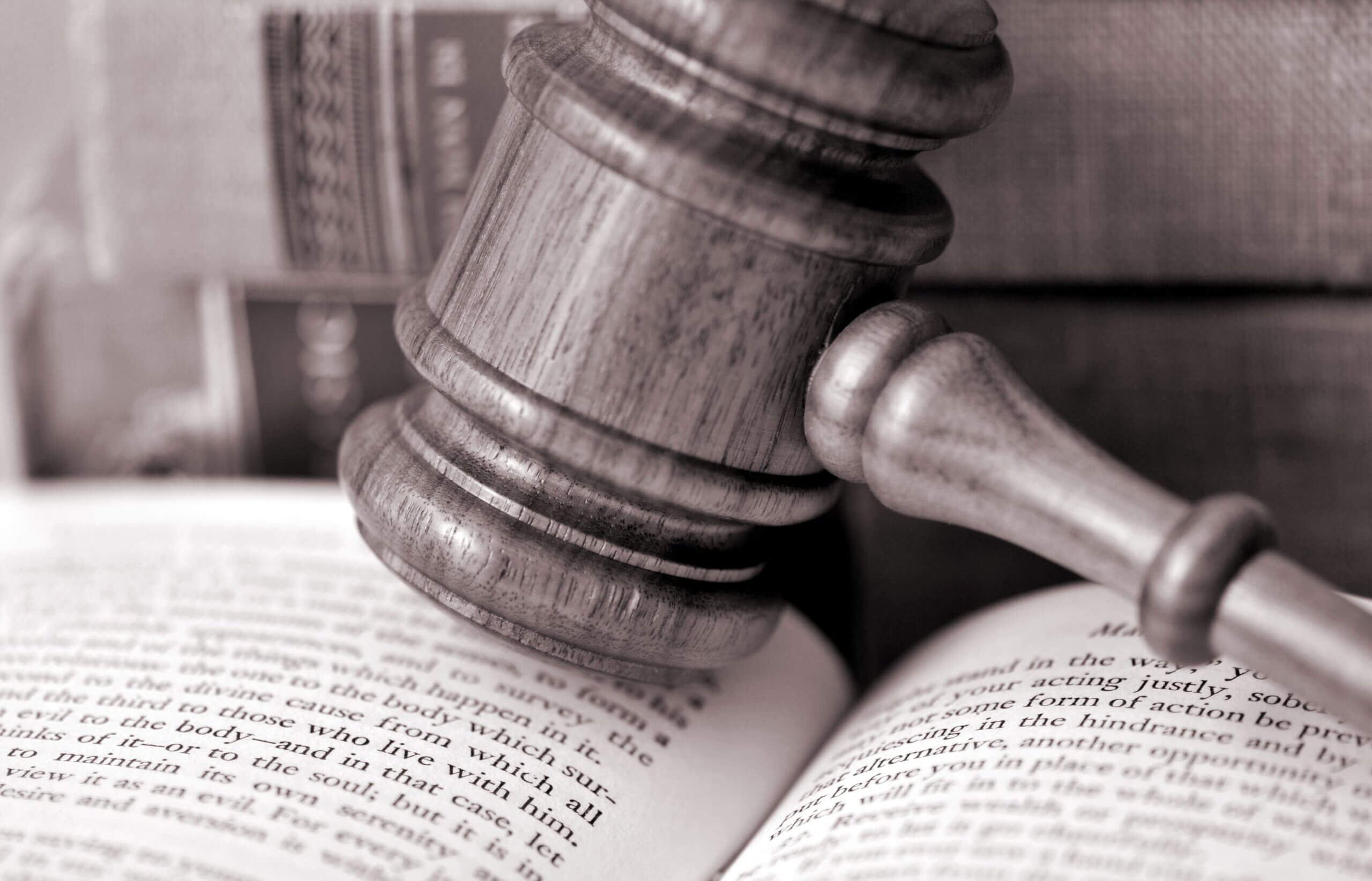 Tampa HOA FAQs - gavel rests upon an open text