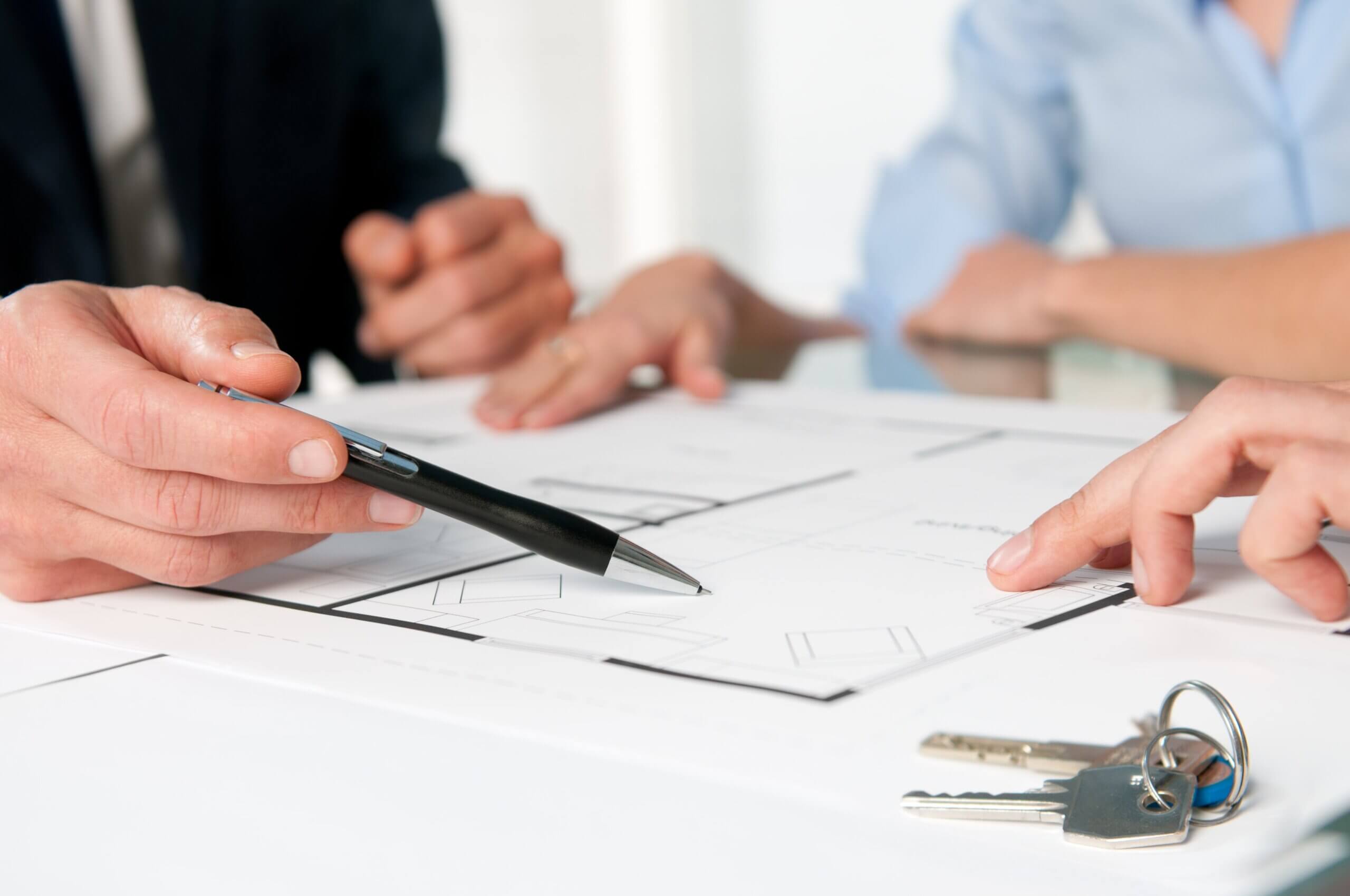 Understanding The Documents You Are Signing - group signing documents at desk